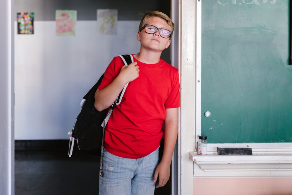 Teen student returning to school in Maryland, highlighting back-to-school mental health, school anxiety, and emotional well-being.